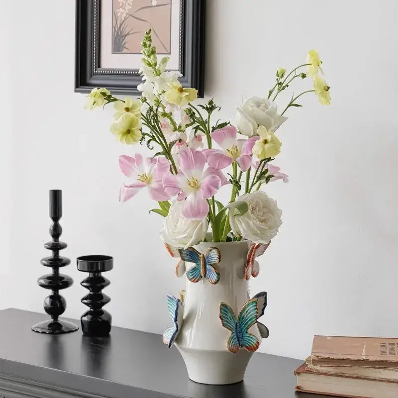 Handmade white butterfly ceramic vase by Decorbites decorated with colorful butterflies for living room decor