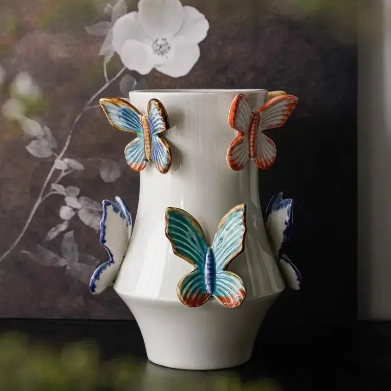 Handmade white decorbites butterfly ceramic vase with colorful blue teal and orange butterfly decor for living room