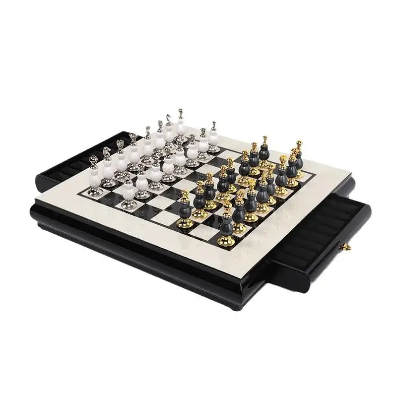 Elegant handmade wooden chess set with black and white marble and gold accents on a glossy foldable board