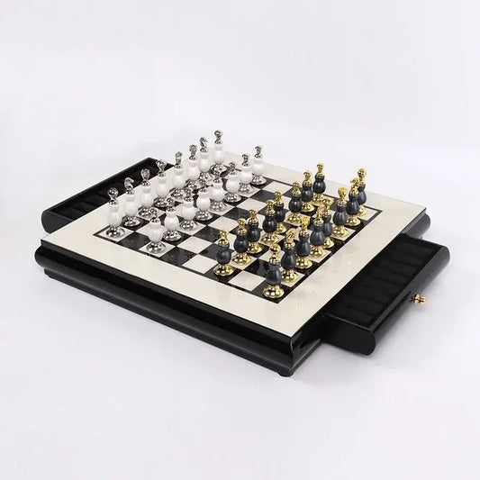 Elegant handmade wooden chess set with black and white marble board and gold-accented pieces in black case