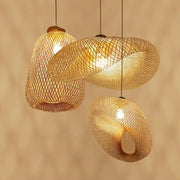 Three hanging pendant decorbites bamboo chandelier lights with woven mesh emitting warm glow for dining room