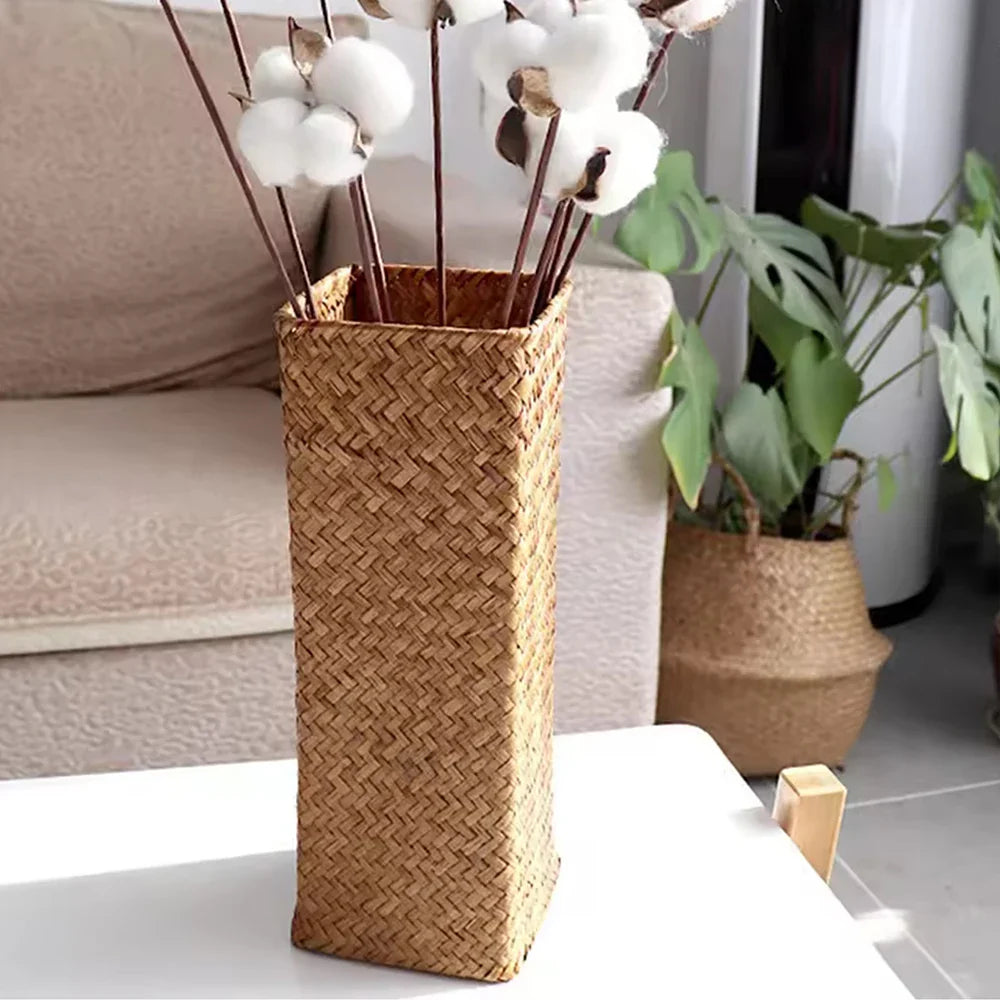 Tall rectangular handmade woven rattan flower vase with natural brown hue and herringbone pattern for home decoration