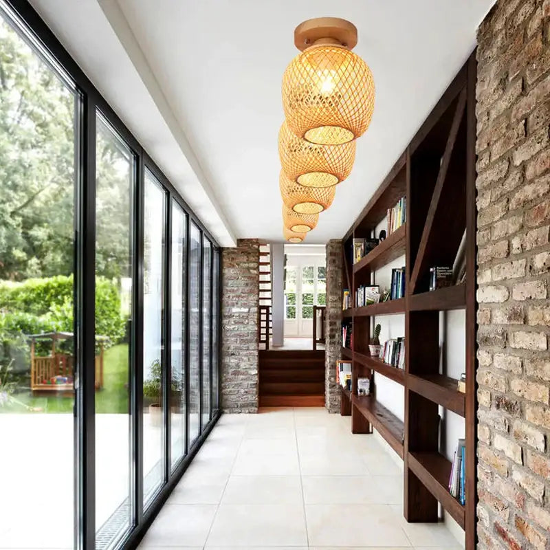 Handwoven warm-toned bamboo birdcage ceiling light with natural textured finish for dining room decorbites bamboo birdcage