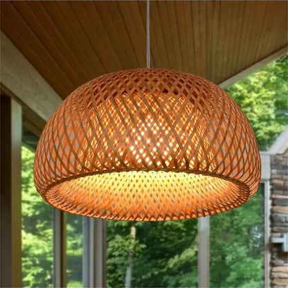 Handwoven beige tone bamboo pendant light with a warm woven dome design made of natural materials for dining room
