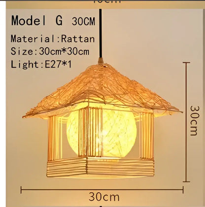 Handwoven black woven pendant light with warm glowing 30cm rattan lantern and wooden frame for dining room