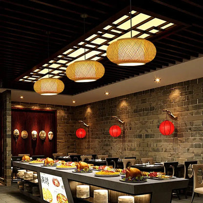 Handwoven black woven pendant light with warm bamboo texture and natural golden hue for dining room lighting