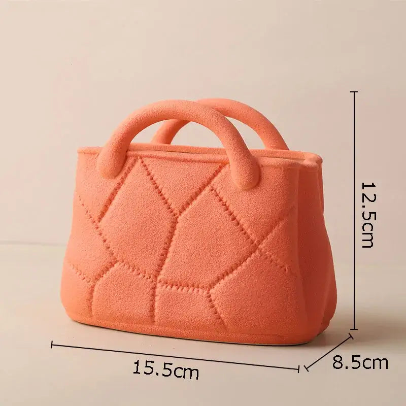 A coral-colored textured ceramic vase with quilted diamond pattern and rounded handles by decorbites handwoven ceramic