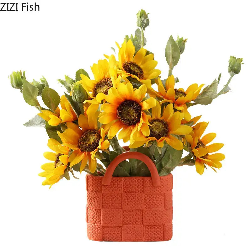 A vibrant orange handwoven ceramic vase basket planter with artificial yellow sunflowers for living room decorbites decor
