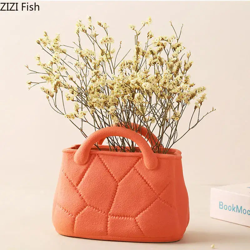 Coralb-colored quilted decorbites handwoven ceramic vase shaped like a handbag with two rounded handles for living room decor