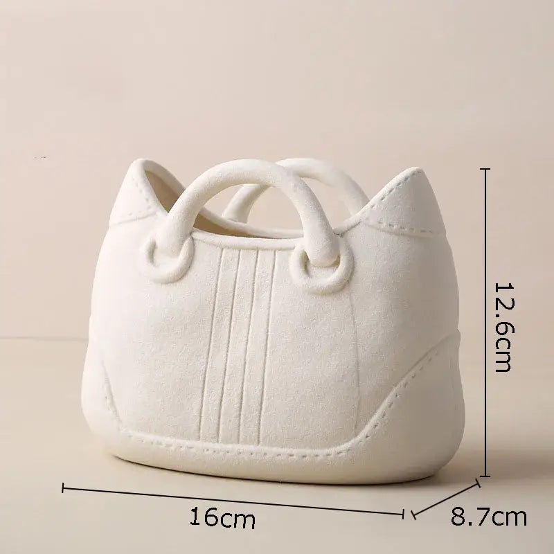 White ceramic ceramic vase handbag-shaped planter with stitched detailing and looped handles by decorbites handwoven ceramic
