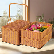 Handwoven rattan picnic basket with lid rectangular outdoor storage filled with colorful fruits and vegetables