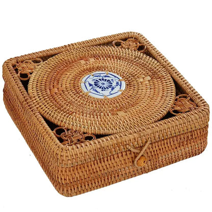 Handwoven rattan storage box with blue ceramic lid featuring a natural woven rattan coaster set by Decorbites