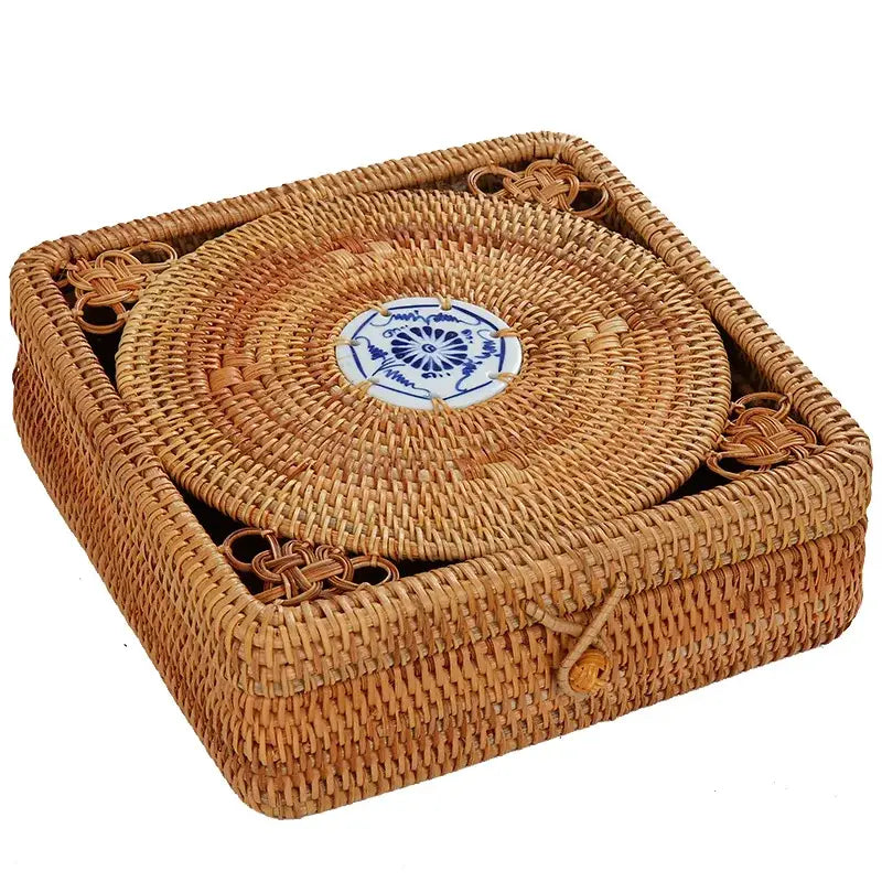 Handwoven rattan storage box with blue ceramic lid featuring a natural woven rattan coaster set by Decorbites
