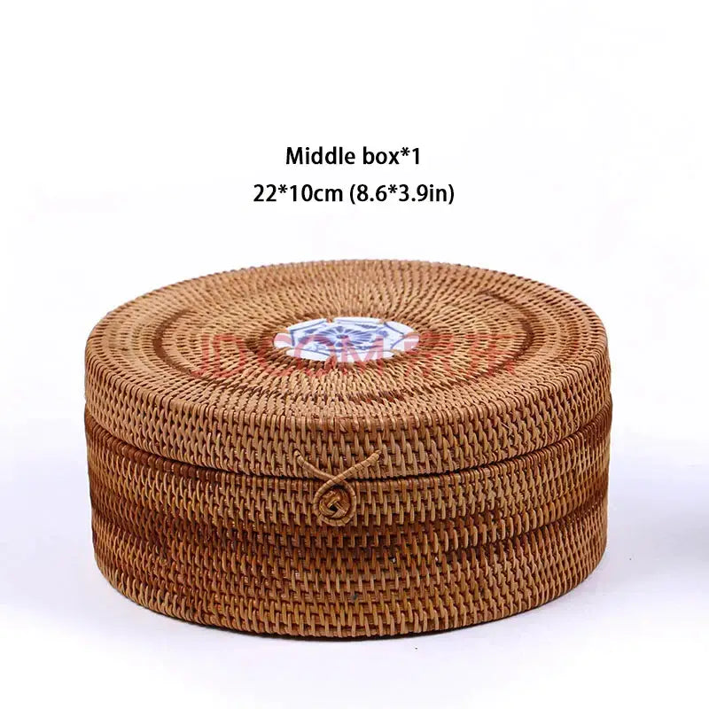 Handwoven rattan storage box by decorbites with round brown woven design and decorative blue and white ceramic disc
