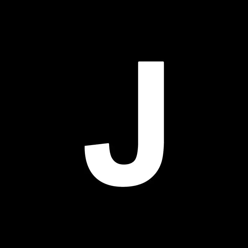 A bold white capital letter j on a black background for decorbites heart cake mold used in kitchen baking