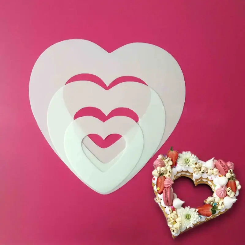 Set of three translucent white heart cake mold stencils and a decorated heart pastry for kitchen baking decorbites heart cake