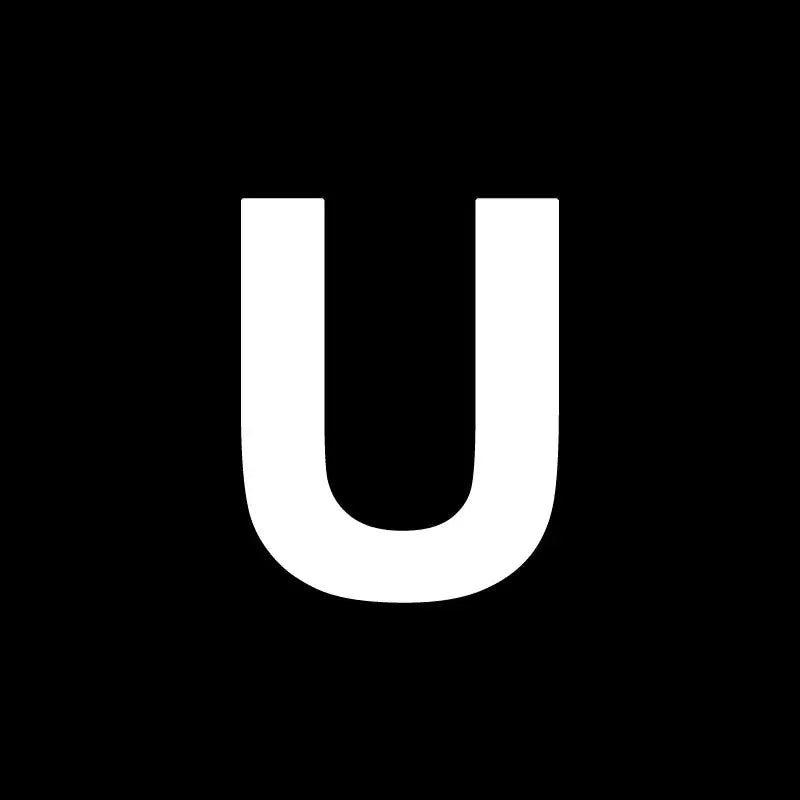 White uppercase letter u on black background for decorbites heart cake mold used in kitchen baking and decorating