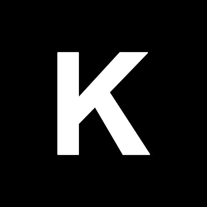 White uppercase letter k on a black background for decorbites heart cake mold in kitchen baking and decorating