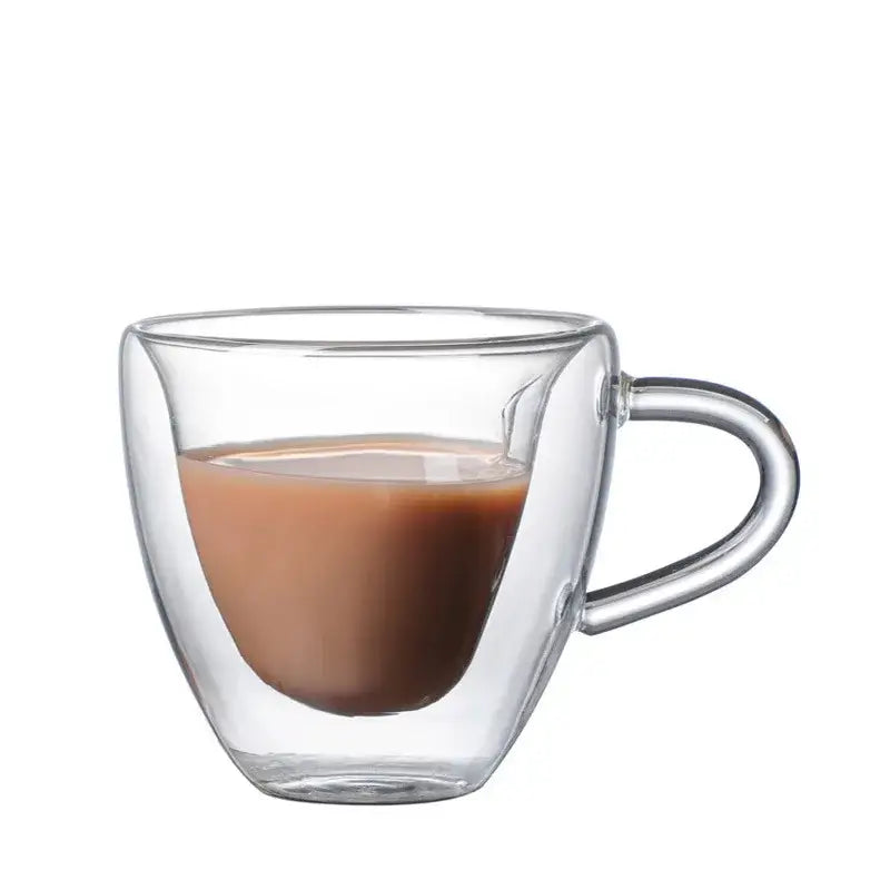 Clear double-walled heart glass mug filled with brown liquid from decorbites glass mug set for kitchen use