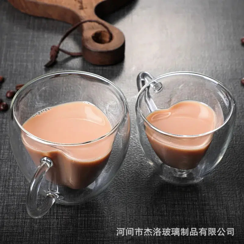 Clear double-walled glass heart glass mug set with creamy brown tea for decorbites heart glass drinkware collection
