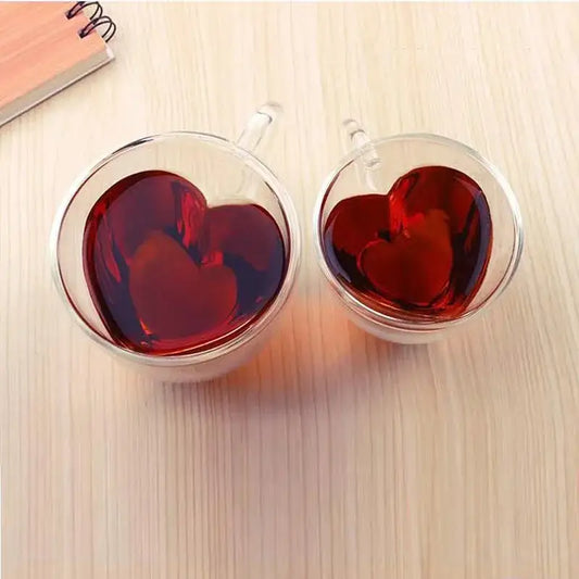 Two clear double-walled glass heart love coffee mugs with red liquid for kitchen drinkware set