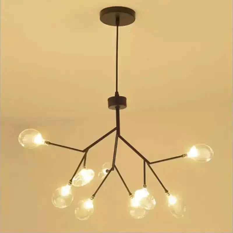 Black metal decorbites heracleum firefly chandelier with gold glass globe bulbs in branching tree-like design for dining room