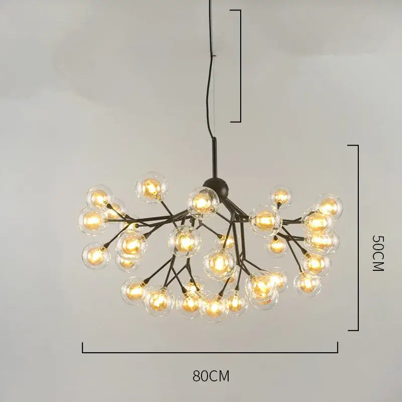 Black metal decorbites heracleum firefly chandelier with clear glass globe bulbs emitting warm dining room light glow