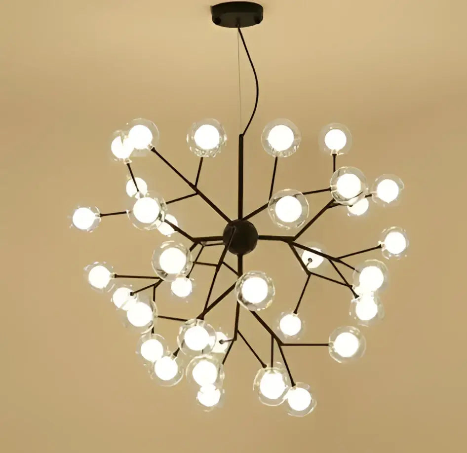 Black metal decorbites heracleum firefly chandelier with clear glass globe bulbs in a branching dining room design