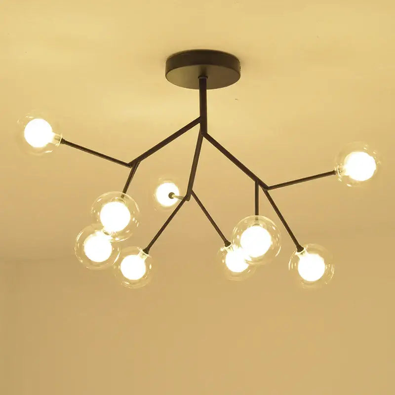 Modern black metal decorbites heracleum firefly chandelier with clear gold glass globe bulbs in branching tree design for dining rooms
