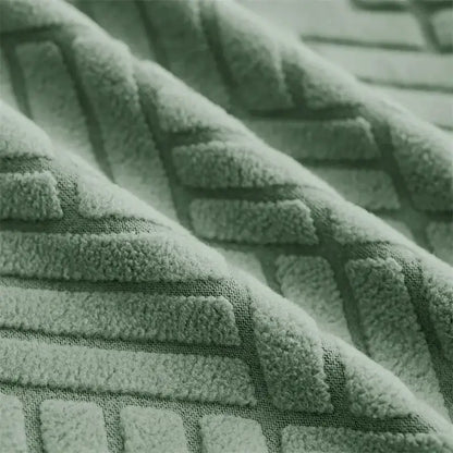 Soft mint-green herringbone jacquard elastic armchair slipcover with raised geometric pattern for living room decor