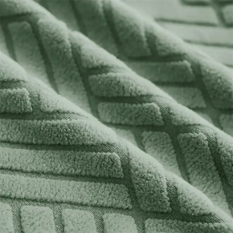 Soft mint-green herringbone jacquard elastic armchair slipcover with raised geometric pattern for living room decor