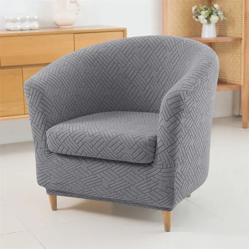 Gray textured fabric armchair slipcover with herringbone jacquard pattern for living room decor