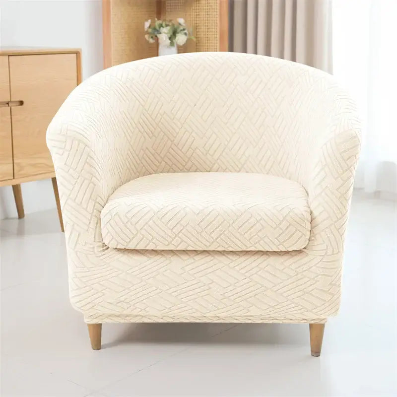 Cream-colored stretchy herringbone jacquard fabric armchair slipcover with subtle woven texture for living room decor