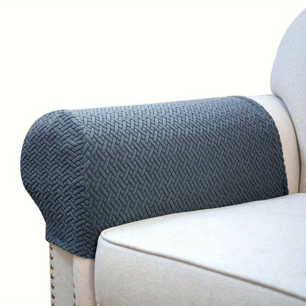 Dark gray textured knit fleece armrest cover snugly fits a light-colored upholstered chair for living room use