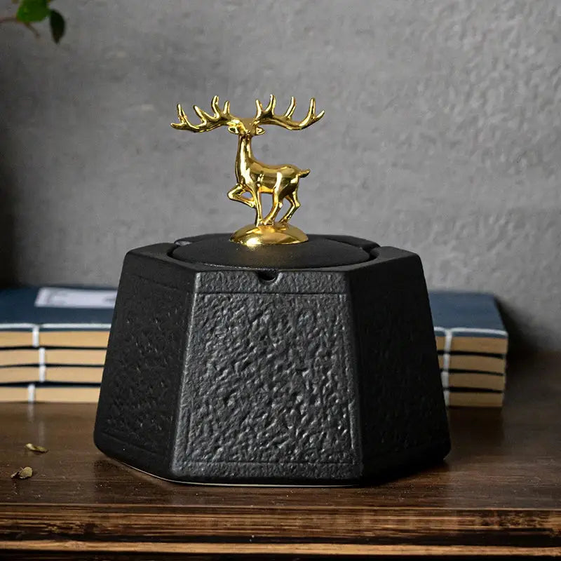 Hexagonal black pottery ashtray with gold deer lid by decorbites black pottery for elegant living room decor