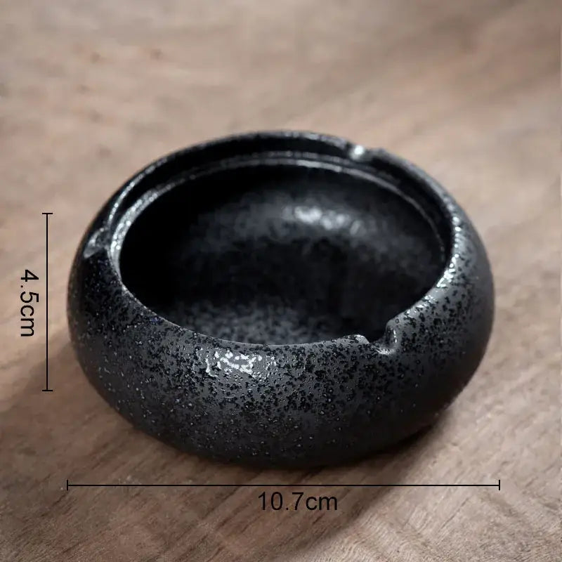 Hexagonal black pottery ashtray by decorbites with black speckled ceramic bowl and slightly raised rim for living room decor