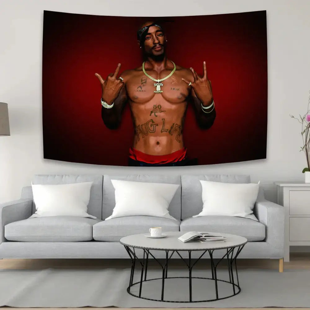 A rectangular hip-hop style wall hanging featuring a shirtless 2pac tapestry with tattoos and gold jewelry on red background