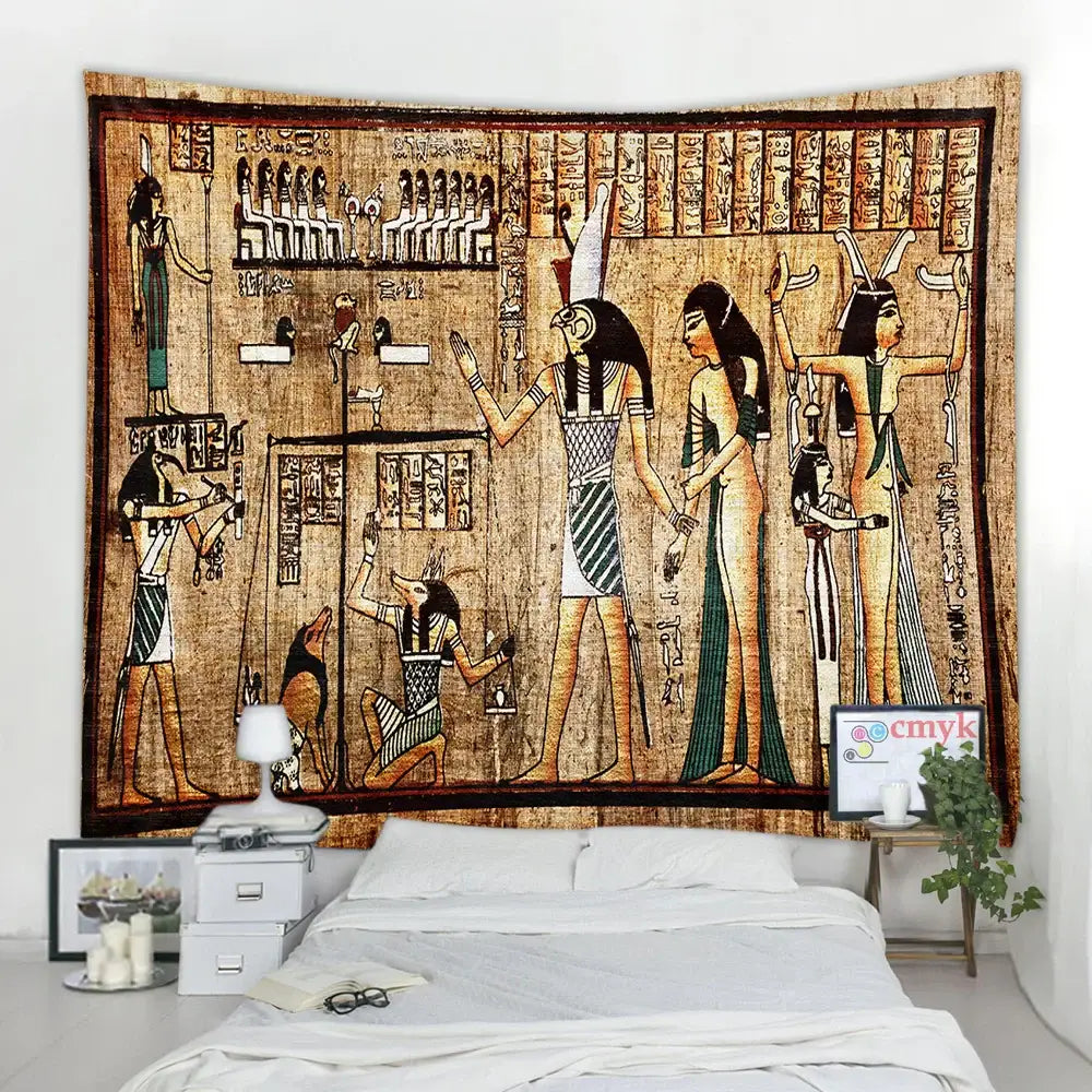 Egyptian pharaoh mural tapestry in earthy tones with hieroglyphics hanging above a bed for bedroom wall decor