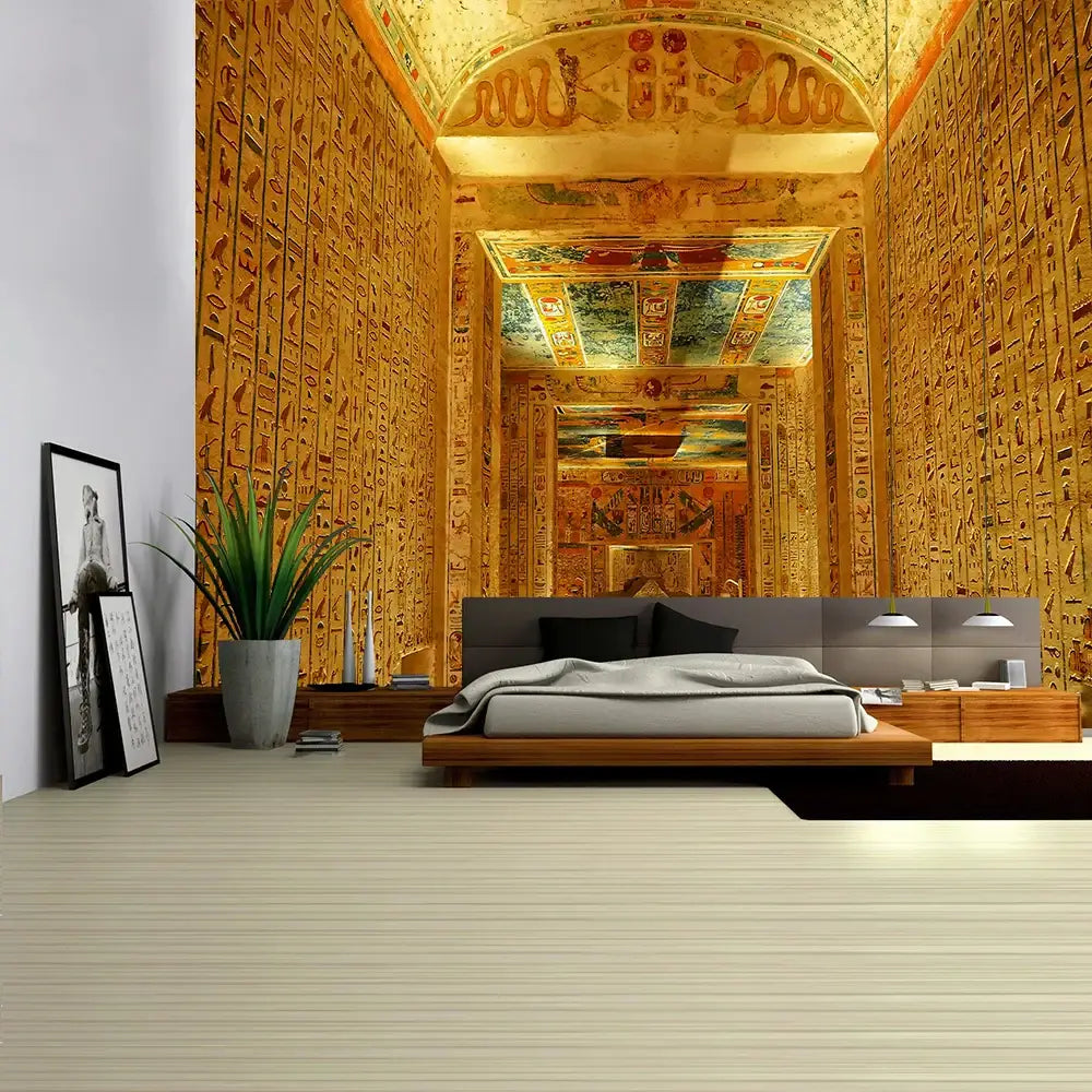 Modern platform bed with sleek gray upholstered headboard and wooden frame beneath egyptian pharaoh mural tapestry wall hanging