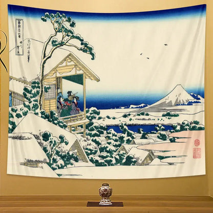 A hanging beach scenery tapestry featuring a traditional japanese winter landscape with mount fuji and snow-covered houses