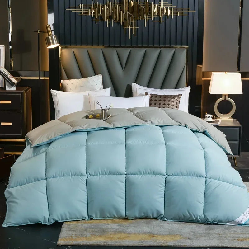 A plush light blue quilted winter comforter with down-like texture and 100% cotton cover for king queen twin beds
