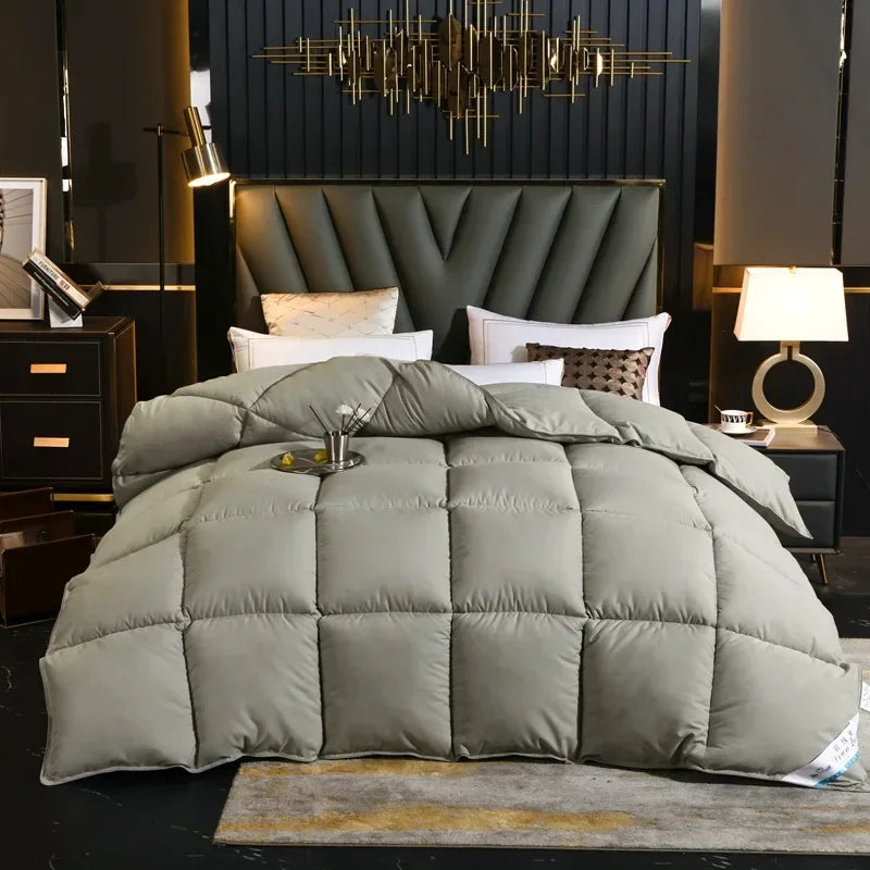 A plush sage green winter quilted blanket with diamond stitching made of 100% cotton cover and down-filled filling