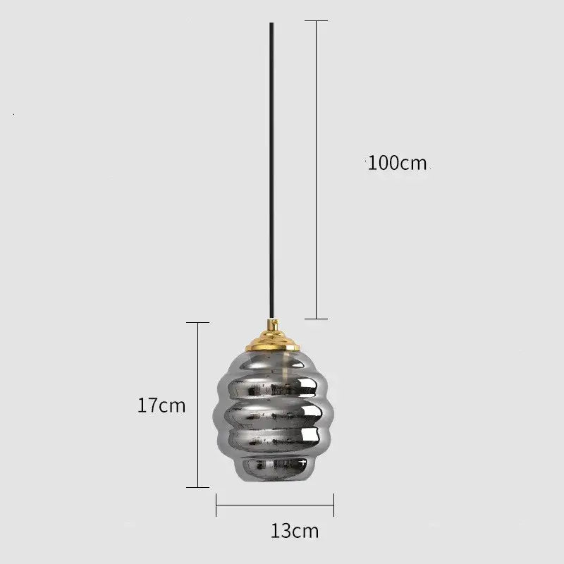 A sleek pendant light with metallic silver honeycomb glass shade and gold top for kitchen dining decorbites colorful glass