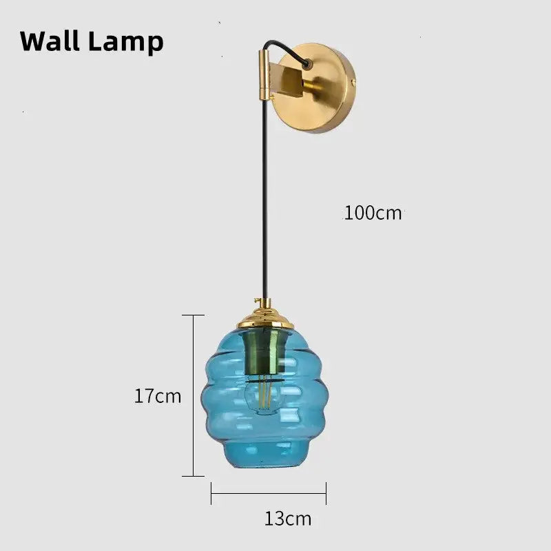 Blue honeycomb-shaped glass pendant light with brass accents featuring decorbites colorful glass for kitchen dining