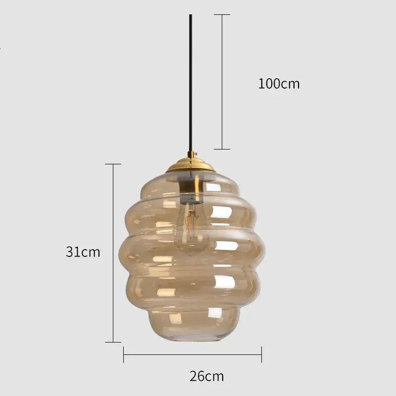 Honeycomb amber glass pendant light with brass top and black cord perfect for kitchen dining decorbites colorful glass