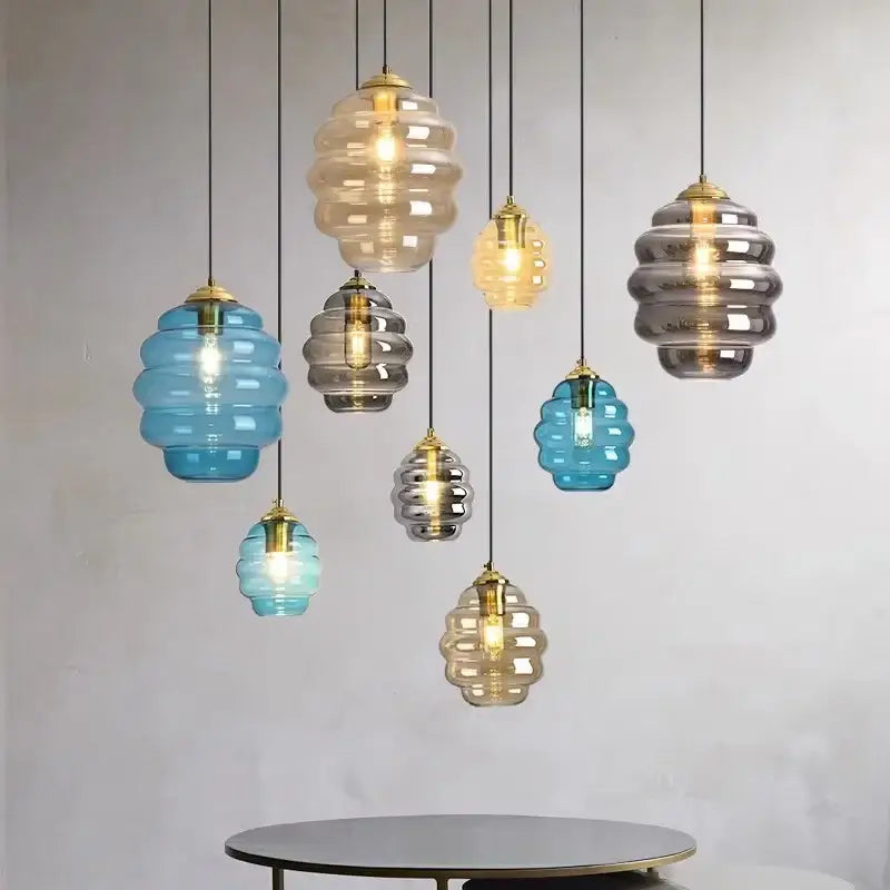 Honeycomb amber blue and gray glass pendant light with gold-toned metal fixtures for kitchen dining decorbites colorful glass