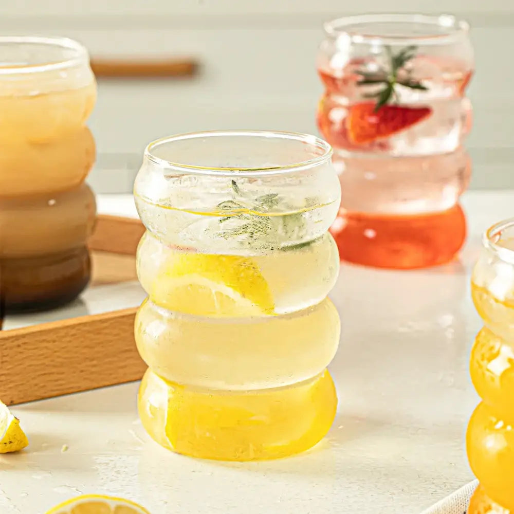 Clear glass creative glass cup with honeycomb design filled with ice lemonade from decorbites glass cup set