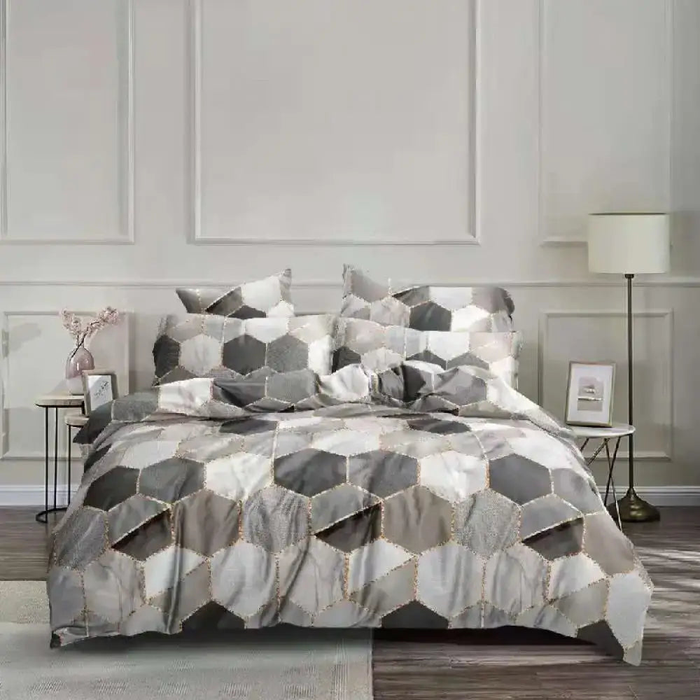 Luxurious gray and white duvet bedding set with hexagonal honeycomb marble pattern and subtle metallic accent from decorbites honeycomb marble collection