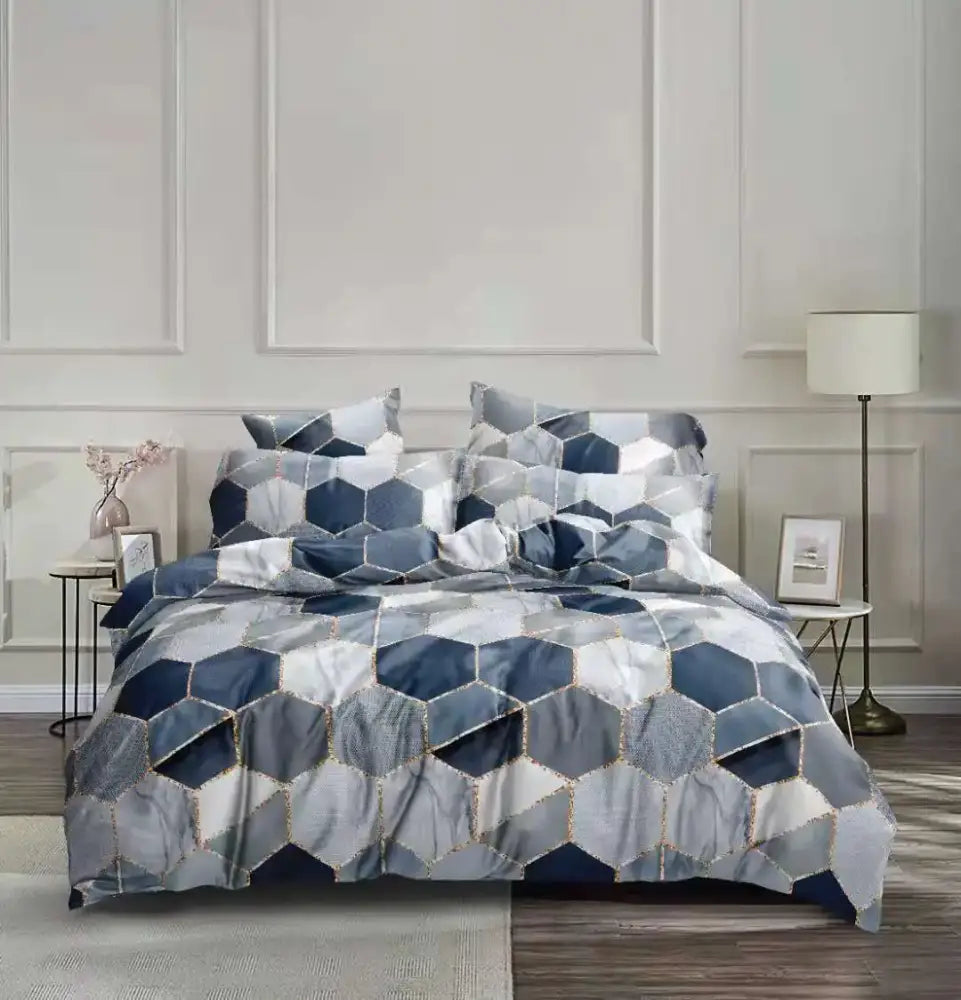 Blue and gray hexagonal patterned bedding set with gold trim from decorbites honeycomb marble collection