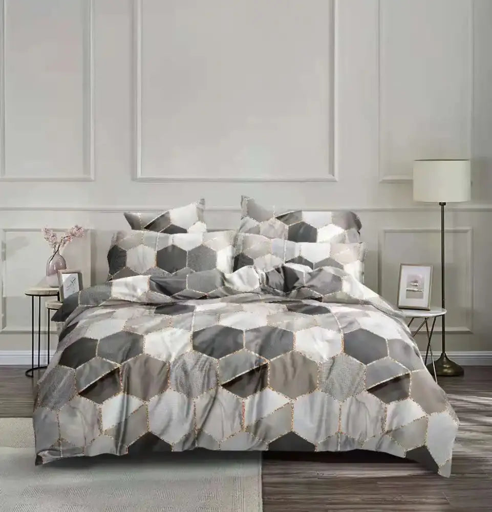 Gray and white hexagonal patterned bedding set with metallic gold stitching for decorbites honeycomb marble collection